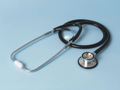 A stethoscope on a pale blue background